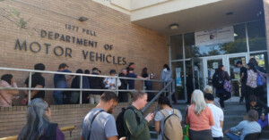 People Waiting at a busy DMV office